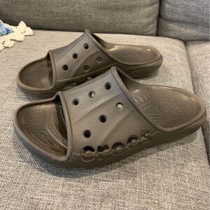 CROCS slides. Brown with crocs logo imbedded. Woman’s size 9, mens 7.